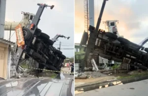 Caminhão guindaste em cima de oito casas no litoral de SP